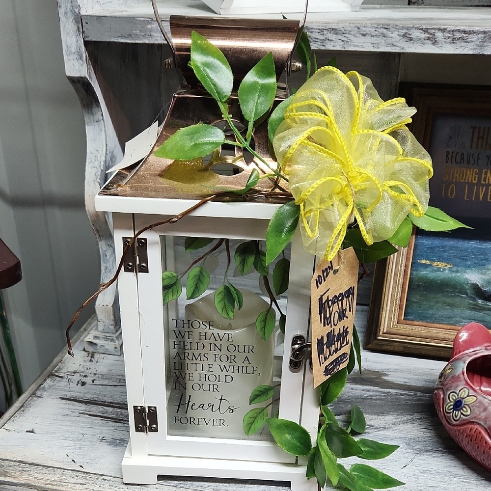 Decorative White Lantern with Yellow Ribbon and Green Leaves